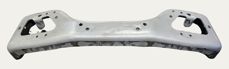 A formed and welded steel part with punched holes